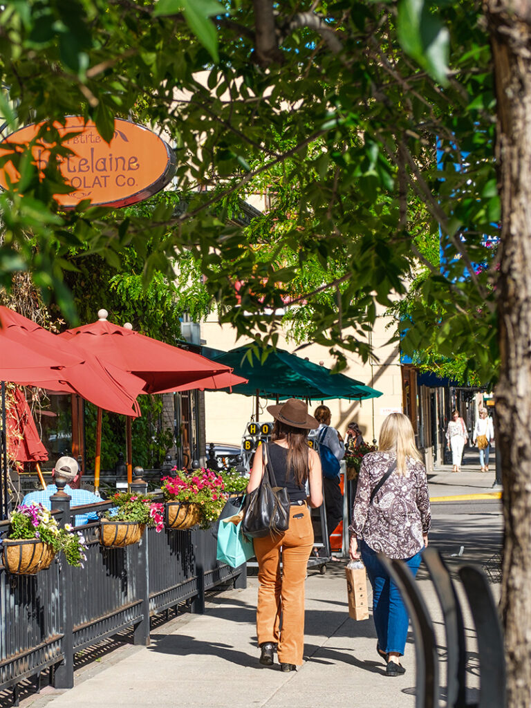Downtown Bozeman shopping and restaurants with people walking.